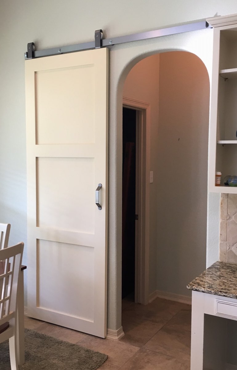 Contemporary style barn door in Minneapolis kitchen.